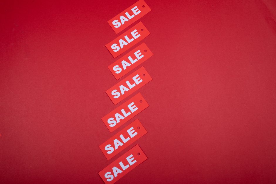 A close-up image showing five yellow plastic letter tiles arranged on a bright blue surface, spelling out the word 'price'. The tiles each have a single lowercase letter in dark blue, with a smooth, g